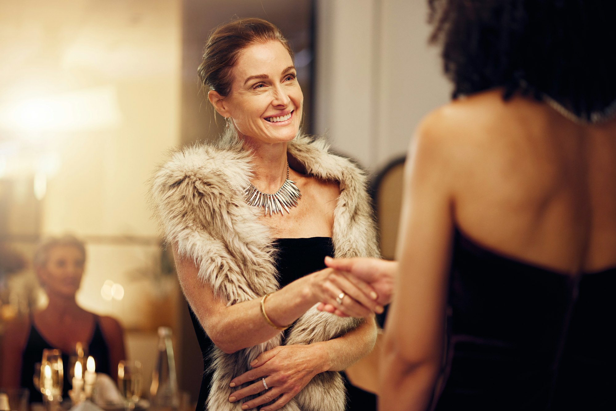 Success, handshake or women in a party shaking hands for partnership agreement at social event. Tha